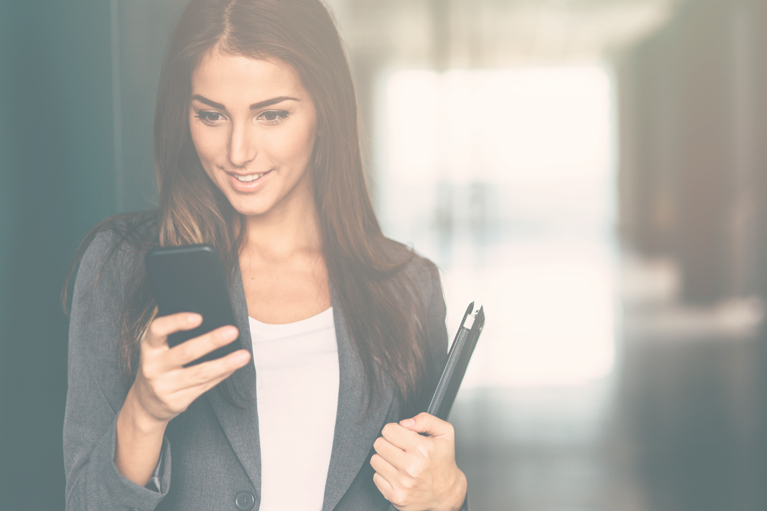 professional woman looking at smartphone